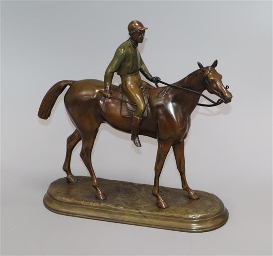 A painted spelter model of a jockey and horse, signed C. Valton height 30cm